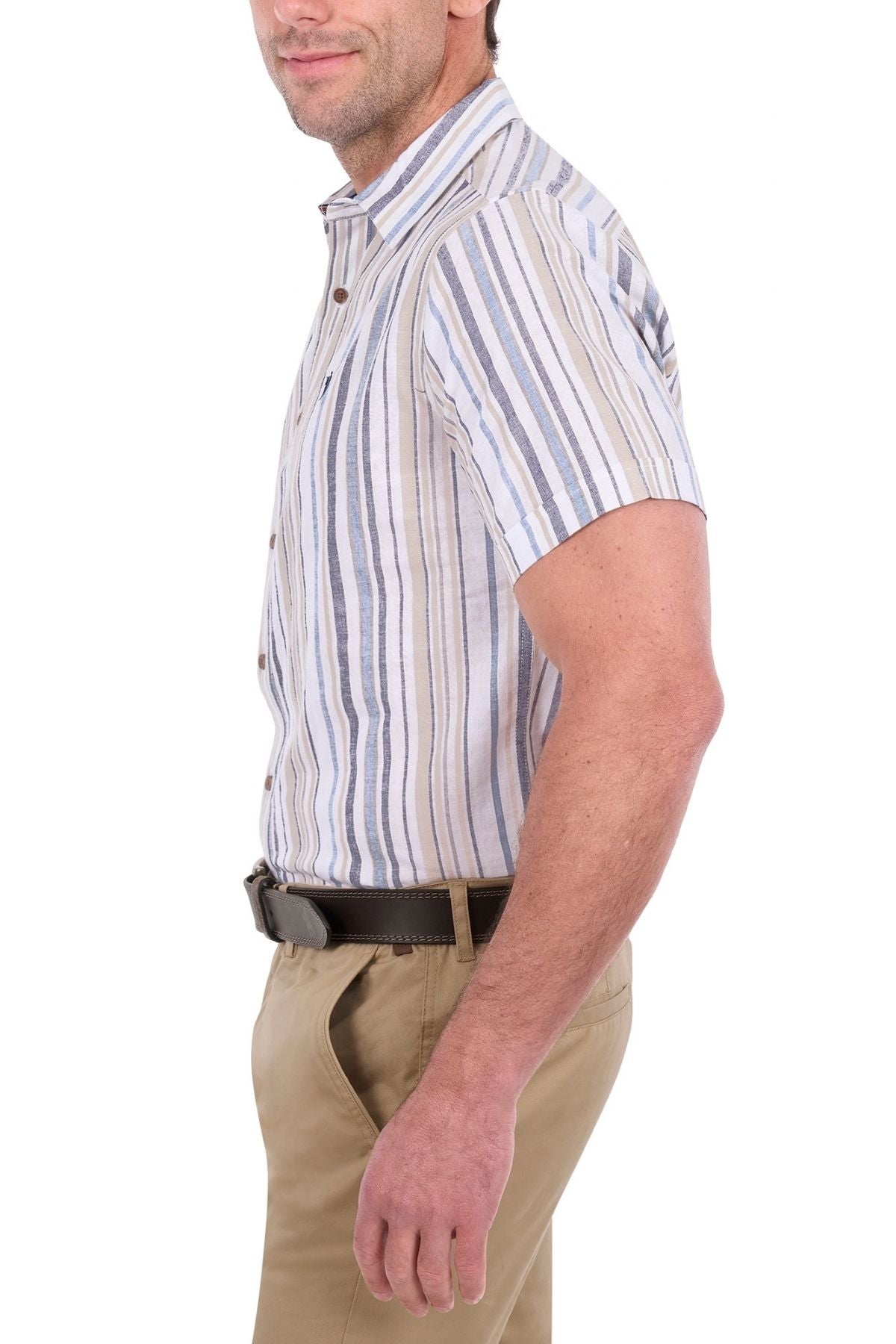 A man wearing the Thomas Cook Max Short Sleeve Shirt with stripes and khaki pants stands sideways, his left hand in his pocket, against a white background.