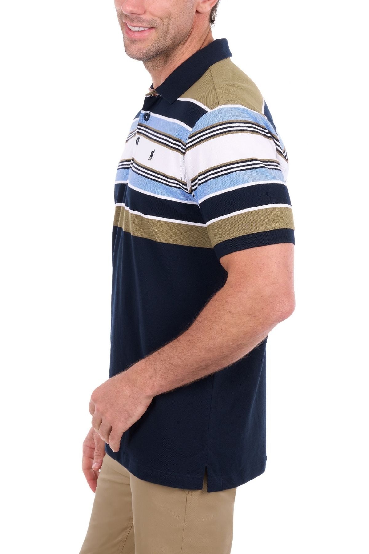 A man wearing the Thomas Cook Phillip Polo, a short-sleeve shirt crafted from cotton pique with navy, olive, white, and light blue horizontal stripes, paired with khaki pants, stands and smiles against a white background.