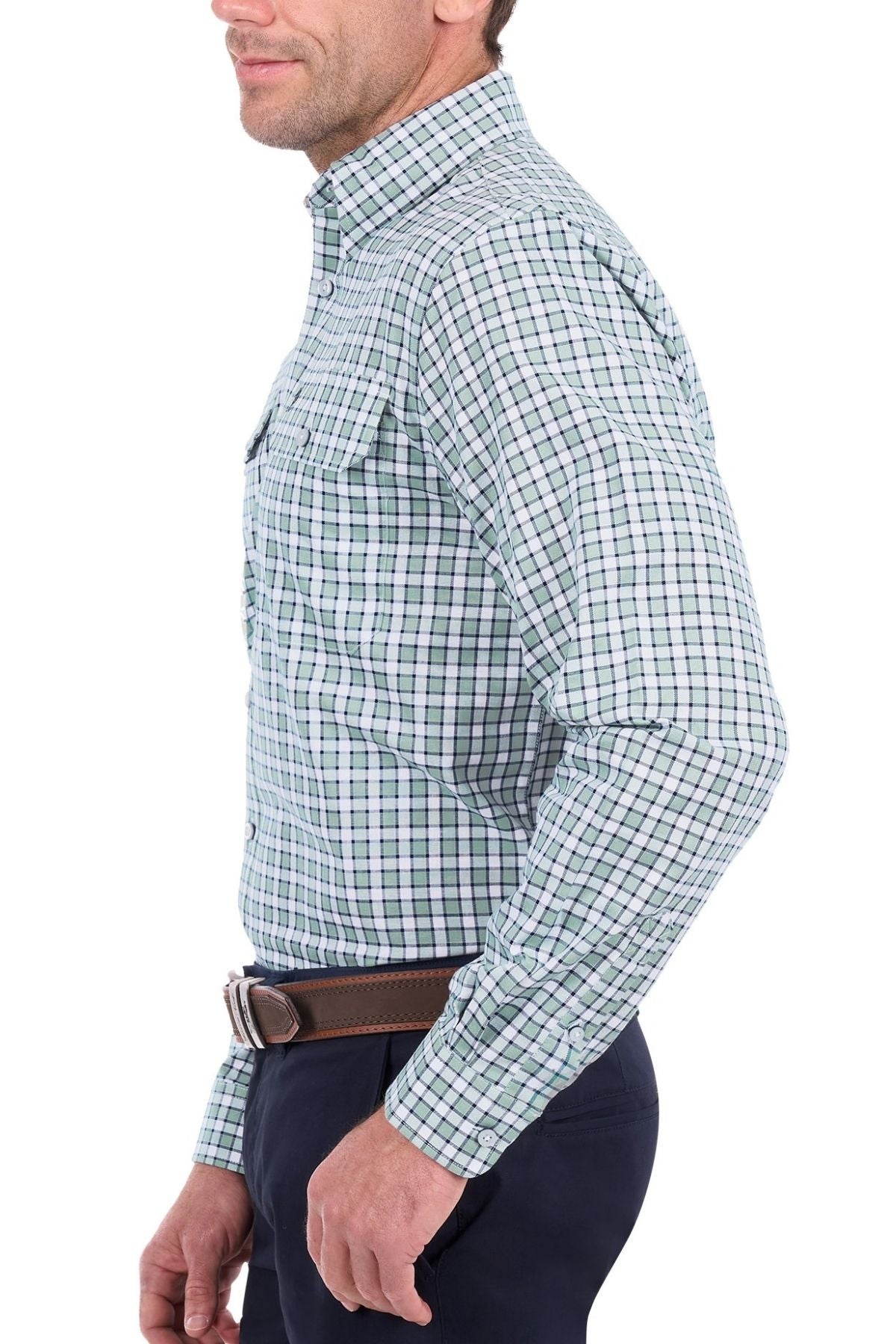 A man is shown from the side against a white background wearing the Thomas Cook Rory Shirt in blue, green, and white plaid with navy pants.