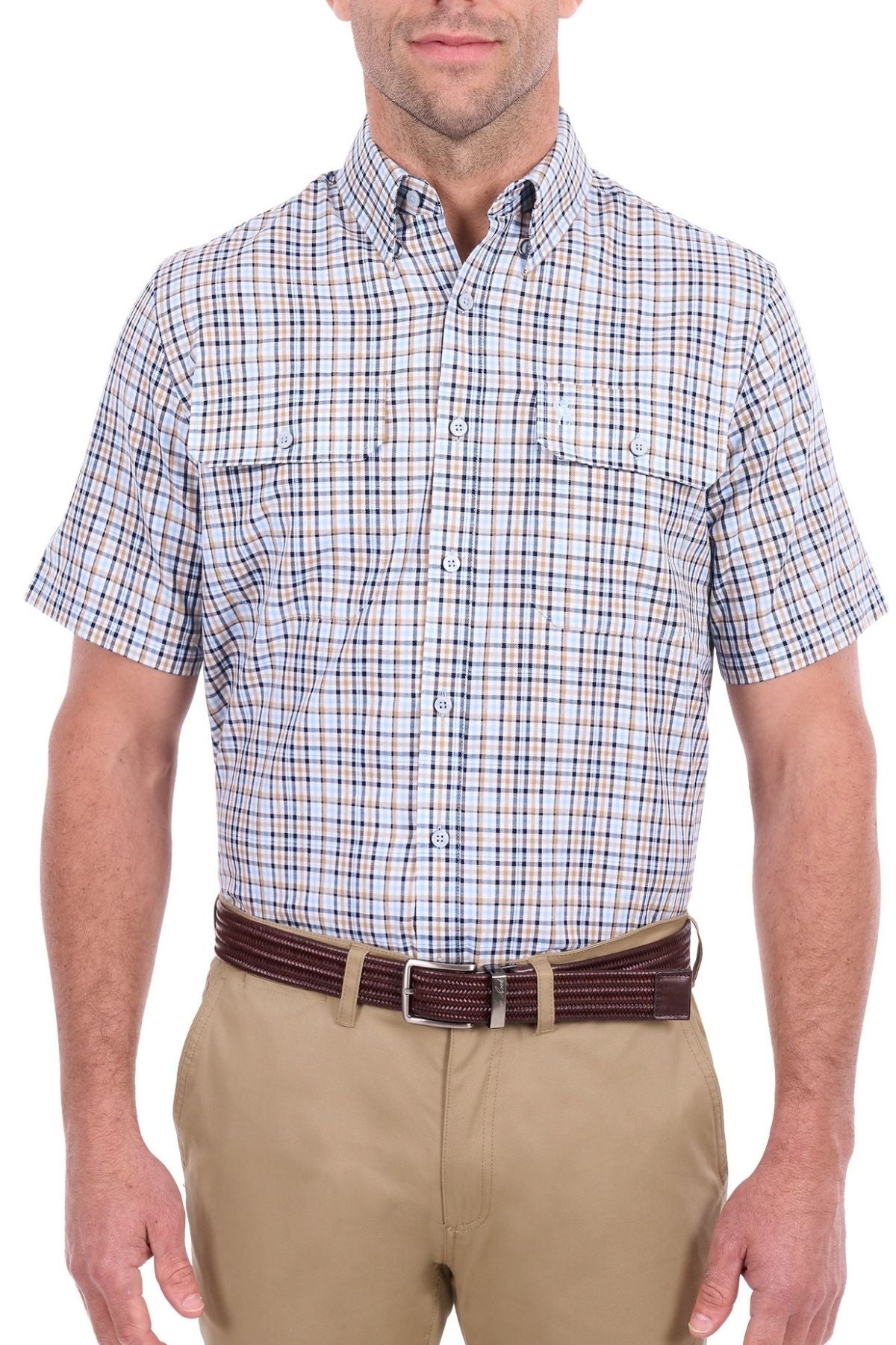 A man wearing the Thomas Cook Ted Short Sleeve Shirt—a blue and brown cotton check Western style with two chest pockets—tucked into khaki pants with a dark brown belt, standing against a white background.