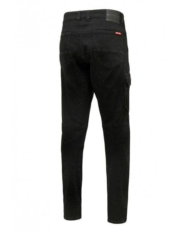 The Hard Yakka Dyneema Tough Jean, displayed on a white background, features a rear view of black slim-fit denim with multiple pockets—including two back and one right thigh pocket—stitching details, and a black label on the waistband. Designed for tear and abrasion resistance.
