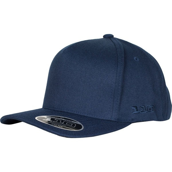 The FlexFit 110 A Frame Cap is a dark blue, structured fitted baseball cap with a curved brim. It features a small, circular sticker at the front and the numbers "110" embossed on the side. This sleek cap offers a minimalist design combined with Flexfit technology for ultimate comfort.