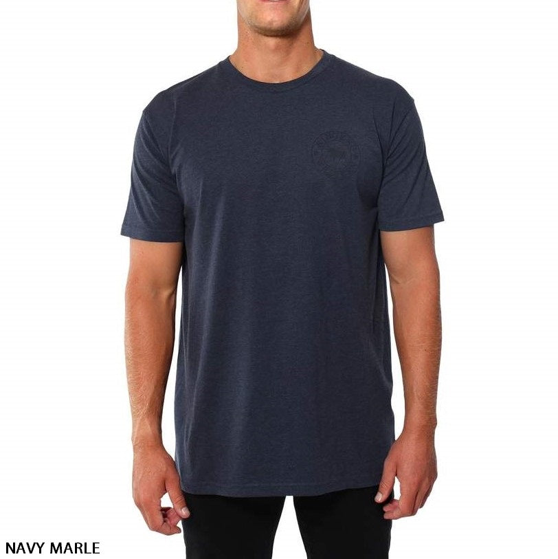 A person is wearing a Ringers Western Signature Bull Original Fit T-Shirt in navy marle, made from 100% cotton. The short-sleeve, comfortable t-shirt features a round neckline and a subtle design on the left side of the chest. The individual pairs it with black pants. Text in the bottom left corner reads "NAVY MARLE, Ringers Western.