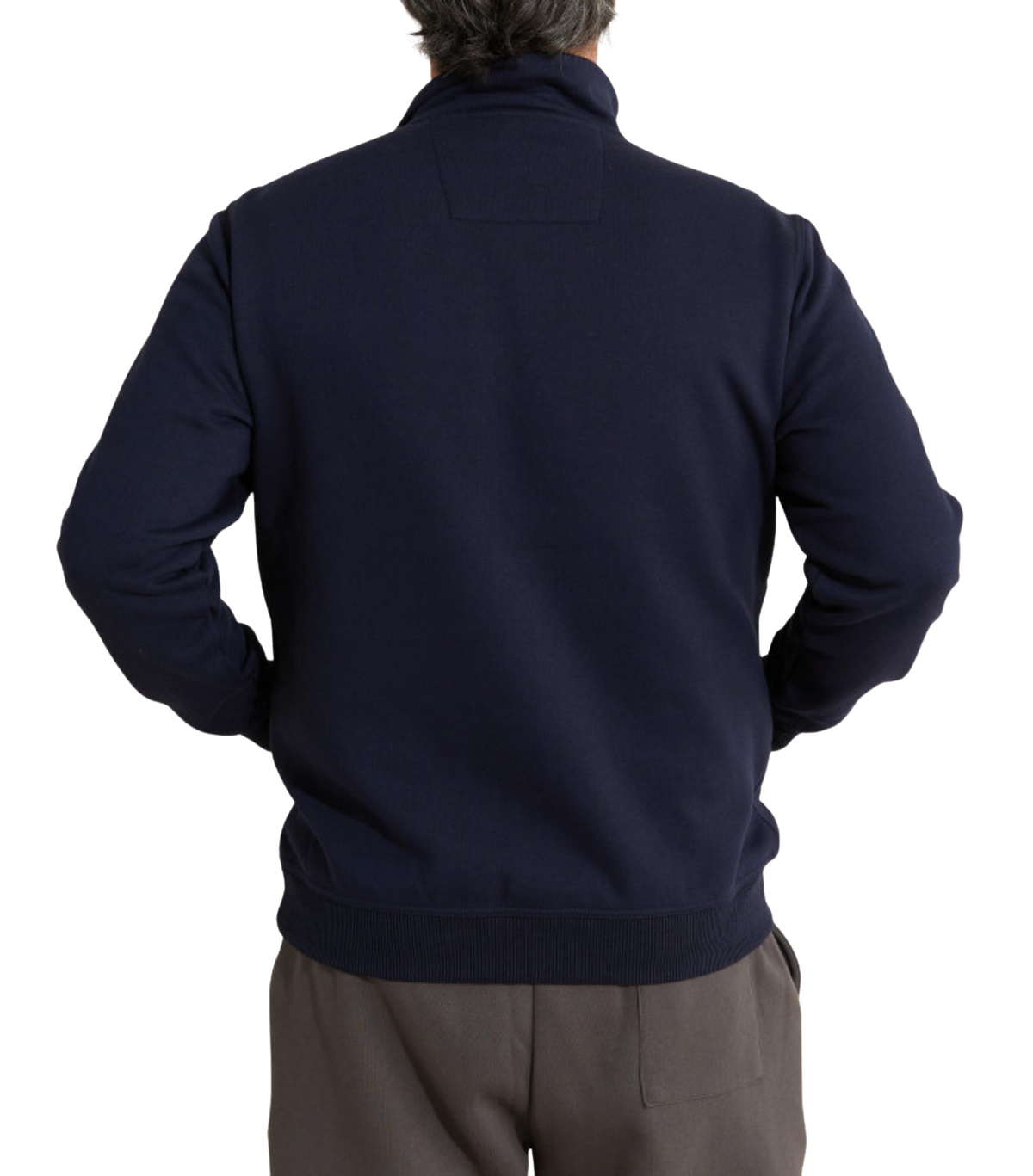 A person wearing the Breakaway Hils Snowy Mt Fleece Half Zip in dark navy, featuring a stand-up collar, is shown from the back. The individual has short, dark hair and is also sporting gray trousers.
