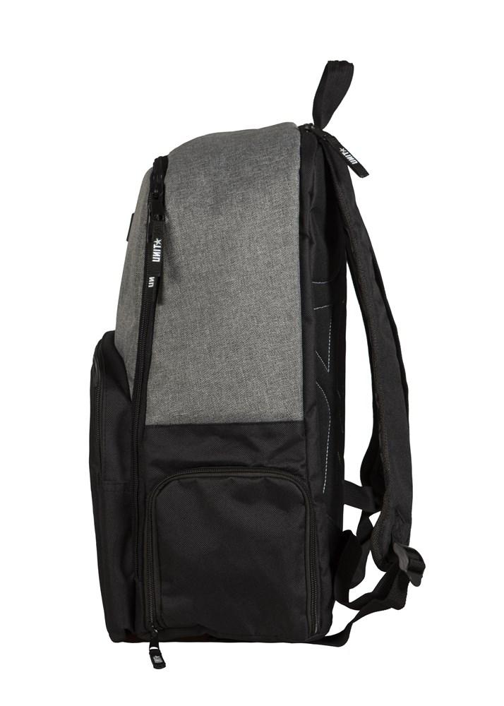 Side view of the UNIT Form Backpack showing a gray top, black bottom, front zipper pocket, side pocket, adjustable shoulder straps, and a visible dedicated laptop compartment.