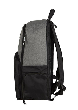 Side view of the UNIT Form Backpack showing a gray top, black bottom, front zipper pocket, side pocket, adjustable shoulder straps, and a visible dedicated laptop compartment.
