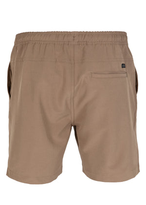 Back view of the UNIT Boardwalk Elastic Waist Short in tan, featuring 4-way stretch fabric, an elastic waistband, side pockets, and a single rear pocket with a small black tag.