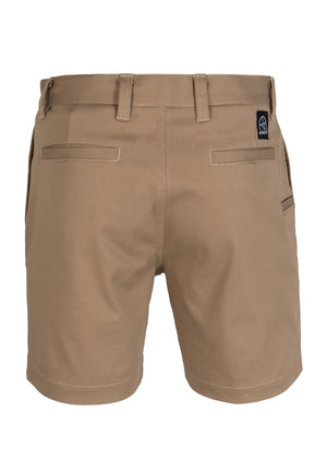 UNIT Trench Stretch Work Short in tan khaki, shown from the back, features belt loops, reinforced button, two back welt pockets, and a black and white skull patch on the right waistband.