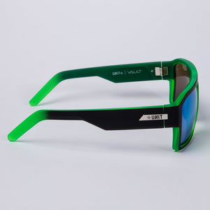 Side view of UNIT Vault Polarised Eyewear in green and black, featuring mirrored blue polarised lenses for UV protection, a lightweight angular frame, and "UNIT" and "VAULT" branding on the arms.
