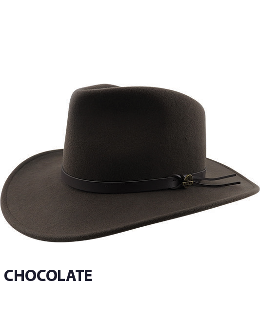 The Man From Snowy River - Craig - Wool Crushable Hat, a dark brown cowboy hat made of crushable wool felt, features a faux leather band around the base of the crown and is shown against a white background. The word "CHOCOLATE" is written in black at the bottom left corner, highlighting this comfortable hat's stylish appeal.