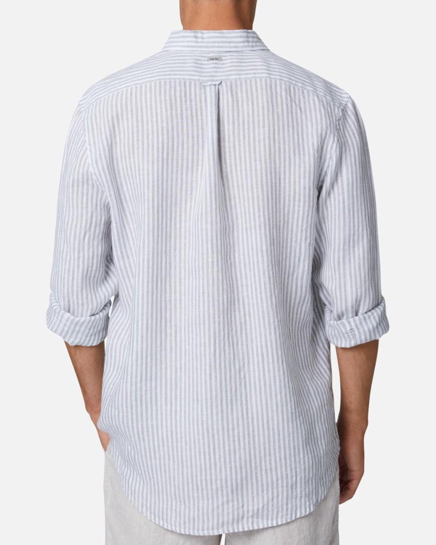 A person is shown from the back wearing the Industrie The Southwest Linen L/S Shirt, featuring a light blue and white vertical stripe pattern, rolled-up sleeves, and a relaxed fit. The background is plain white.