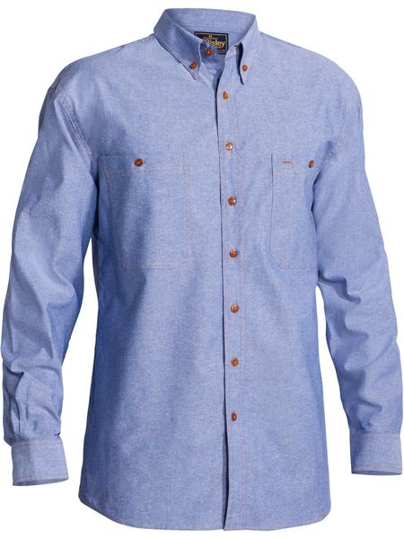 The Bisley Chambray Cotton Shirt is light blue with a traditional fit and button-down collar. It features brown buttons, two chest pockets, and offers a relaxed fit for effortless style.