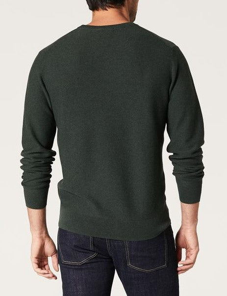 A man is seen from behind wearing the Blazer Mason Cotton Textured Crew Neck in dark green with dark blue jeans against a plain light background.