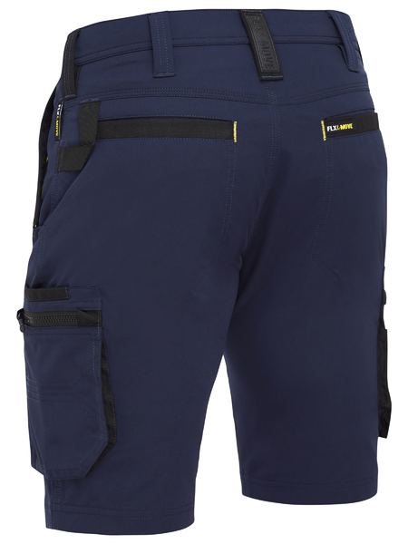 The Bisley Flex & Move 4 Way Stretch Zip Cargo Short showcases a rear view of navy blue shorts with versatile cargo pockets, black accents around the pockets and belt loops, and "FLEXMOVE" visible on the back.