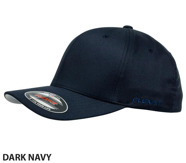A stylish and comfortable dark navy FlexFit Worn By The World Cap with a curved contrast brim. The cap features the Flexfit logo embroidered on the side and has a sticker on the brim with the Flexfit brand and "Yupoong" text. The words "DARK NAVY" are written in bold letters at the bottom left.