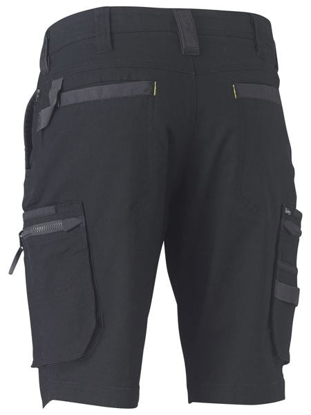 The Bisley Flex & Move Stretch Utility Cargo Short in black features multiple pockets, including two large side cargo pockets with zippers and flaps, as well as smaller front and side pockets. These comfortable shorts are made of durable material with reinforced belt loops and stitching details.