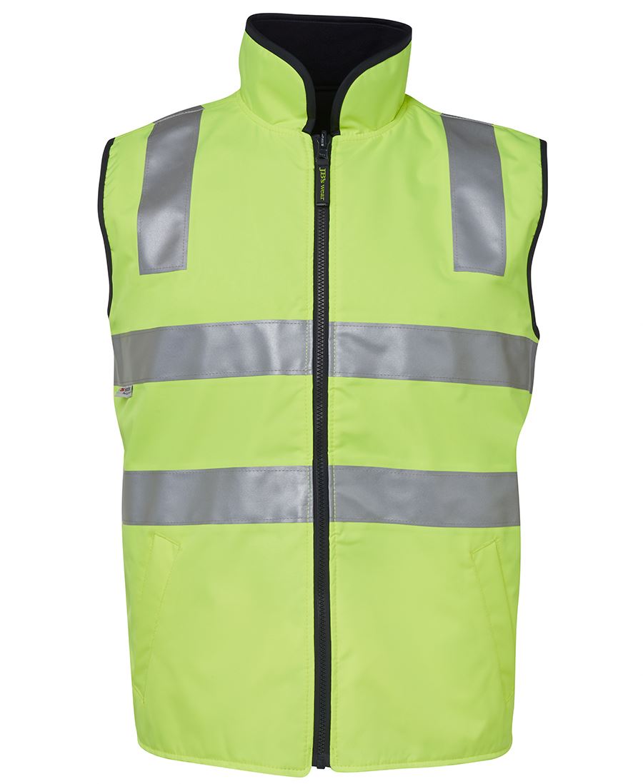 A front view of the JBs Hi Vis Reversible Vest in fluorescent yellow, featuring reflective silver taping that runs horizontally across the chest and abdomen, as well as vertically over the shoulders. This waterproof vest includes a high collar, black inner lining, and is designed to be fully reversible.