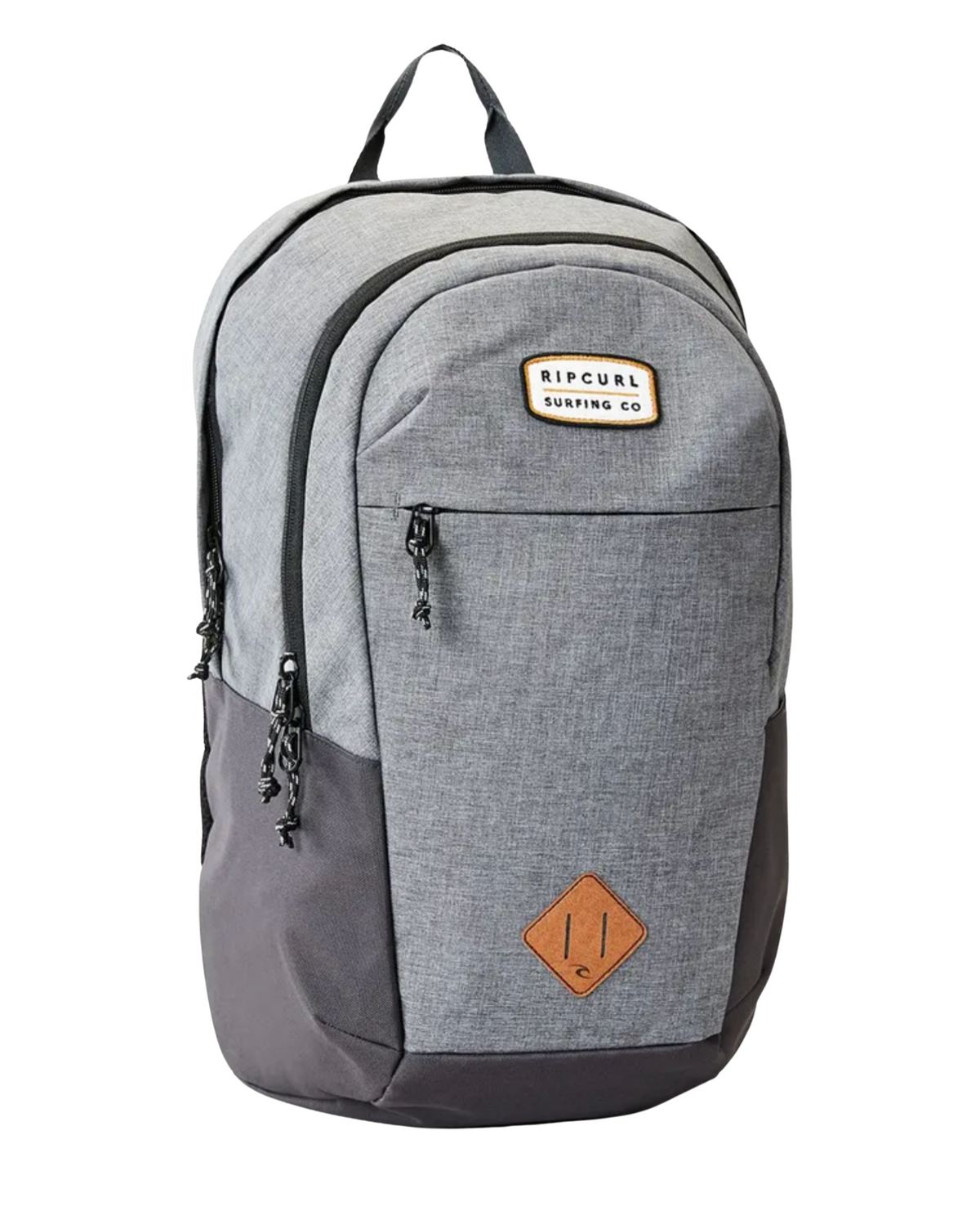 The Rip Curl Overtime 30L Driven Backpack is a gray and black model crafted from recycled polyester. It features a brown "Ripcurl Surfing Co" patch on the top front pocket and includes multiple zippered compartments, a handle, laptop compatibility, and eco-friendly materials.