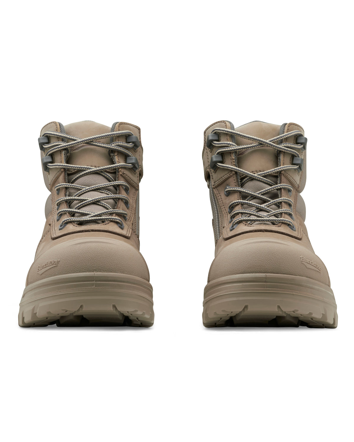 A pair of tan-colored Blundstone RotoFlex 8553 Mid Zip Safety Boots, featuring a rugged design with laces and thick soles, shown from the front. These boots are suitable for heavy-duty wear and feature INFINERGY® technology for added comfort, with the brand name visible on the side near the toe.