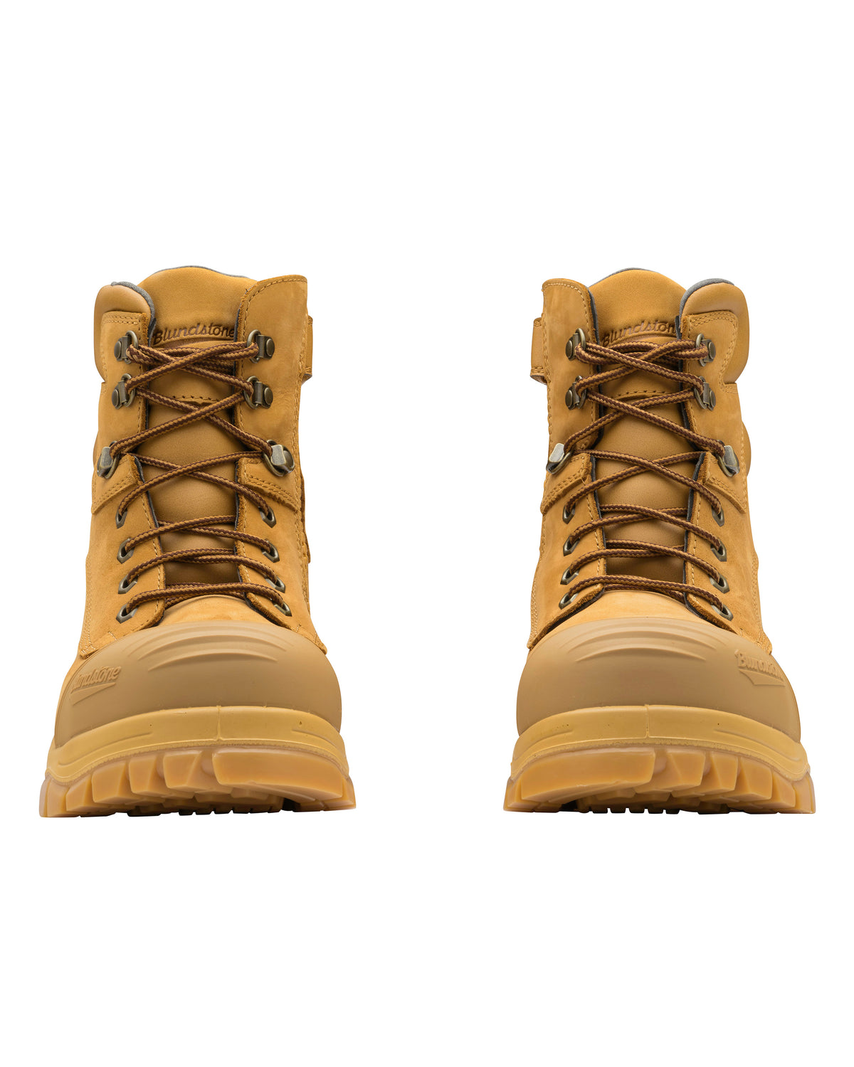 The Blundstone 992 Zip Sided Scuff Cap Safety Boots are tan hiking boots featuring rugged soles and brown laces. These water-resistant work boots are designed with sturdy construction, including reinforced steel toe caps and ankle support. Positioned side by side, they face forward.