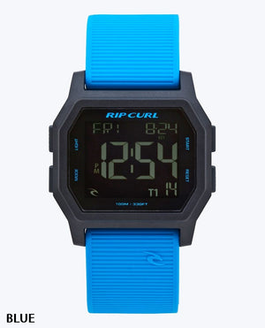 The Rip Curl Atom Digital Watch features a waterproof design, black rectangular face, bright blue textured strap, and displays time, date, day with the Rip Curl logo above the screen.