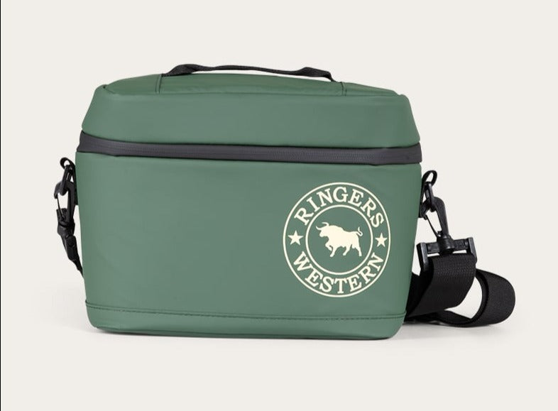 The Ringers Western Newport Soft Cooler Bag is a green rectangular insulated cooler bag featuring the distinctive Ringers Western logo in white, showcasing a bull within a circular emblem. It includes a black adjustable carry strap, a top handle for easy carrying, and a convenient mesh pocket on the side.