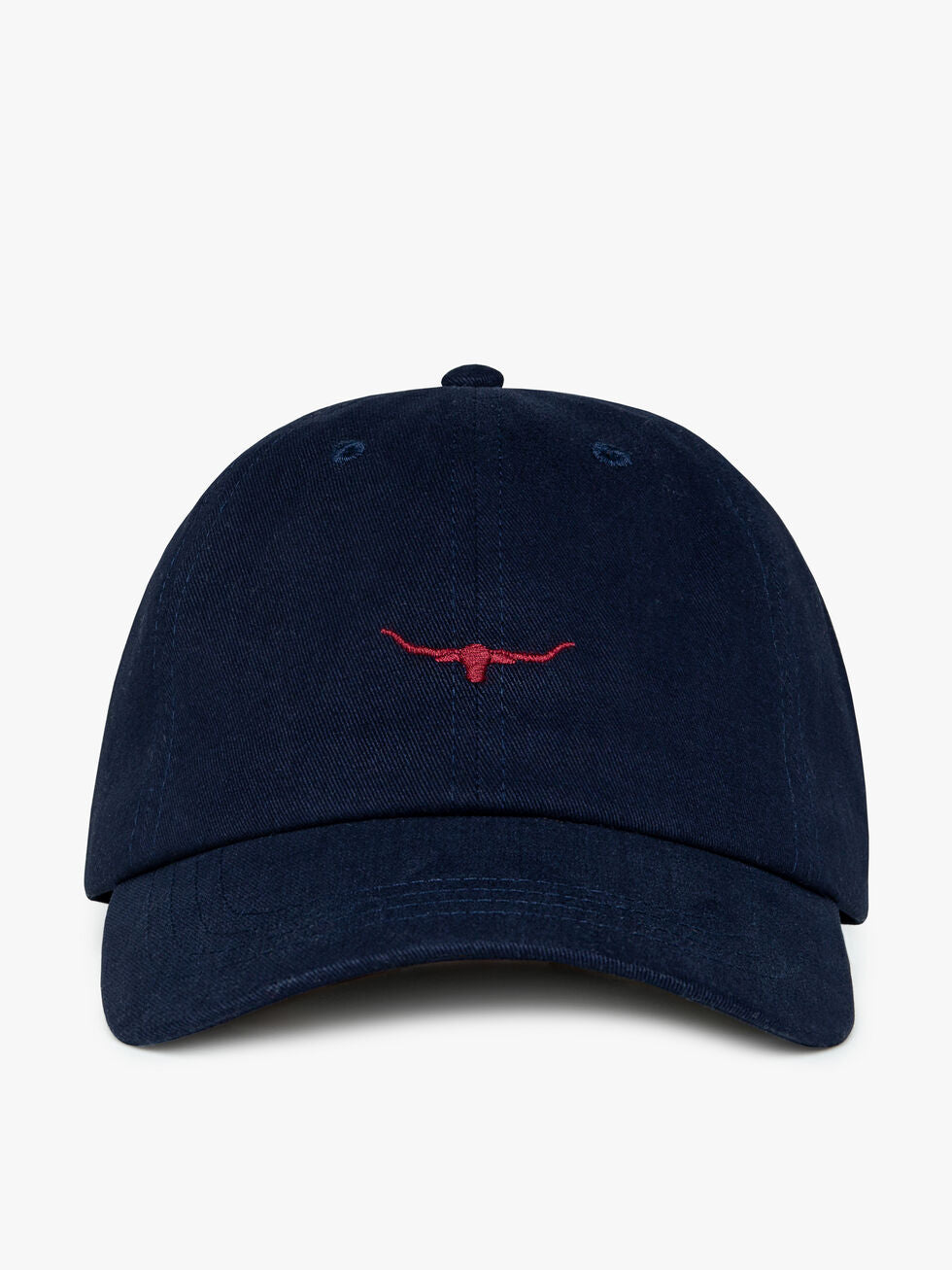 The RM Williams Mini Longhorn Cap is navy blue, made from 100% cotton, and features a small red embroidered steer head logo on the front, shown against a plain white background.