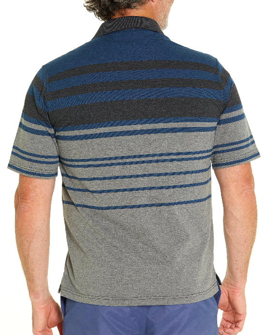 A person facing away from the camera is wearing the Breakaway Mariano Kinnersly Jersey Polo, featuring short sleeves and horizontal stripes in various shades of blue and gray. The individual, with short, curly hair, complements the polo shirt with blue pants for a relaxed yet stylish look.