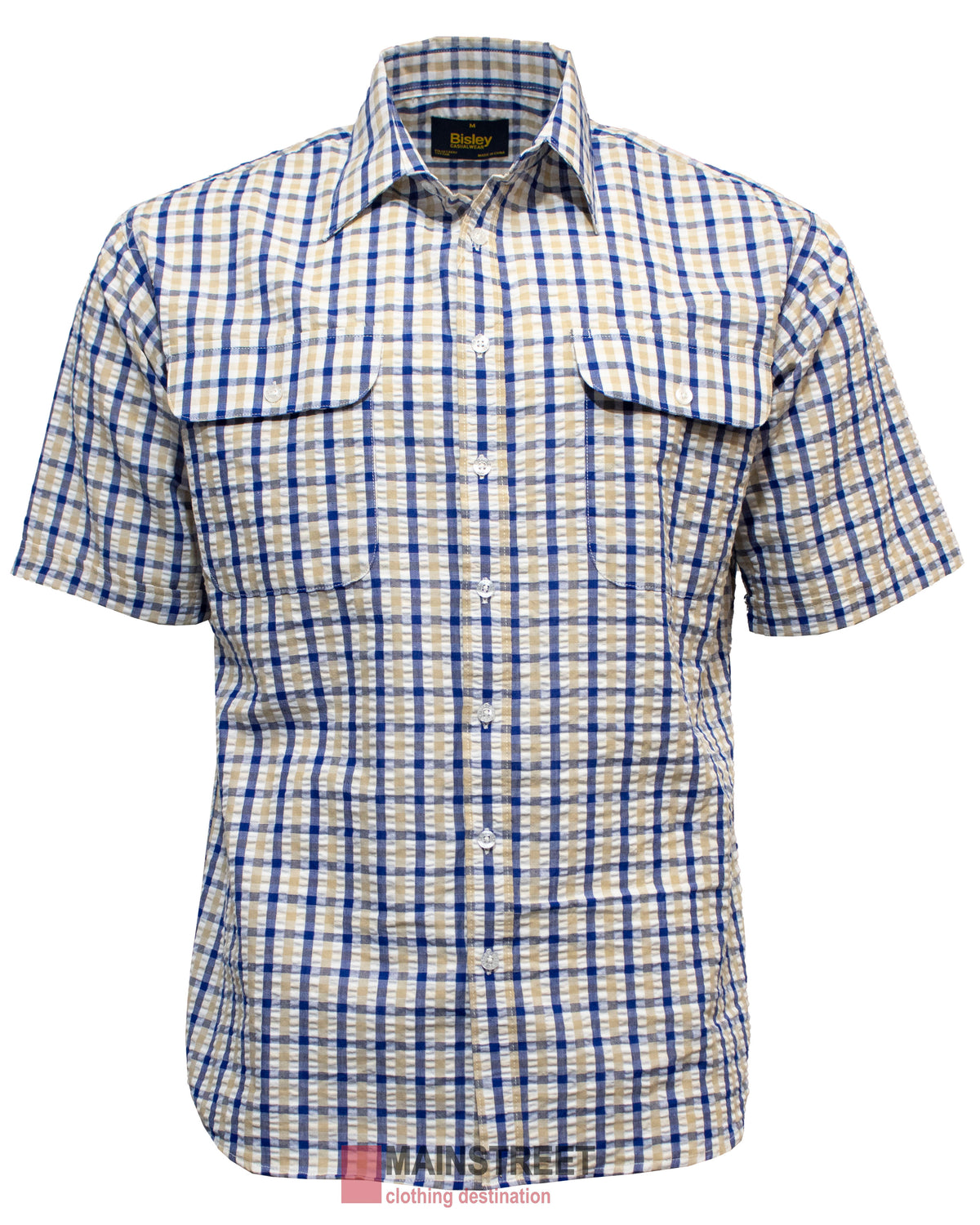 The Bisley Countryman Seersucker Short Sleeve Shirt, made from a soft polyester/cotton blend, showcases a blue and beige plaid pattern with short sleeves. It features two large front flap pockets and a pointed collar, set against a white background.