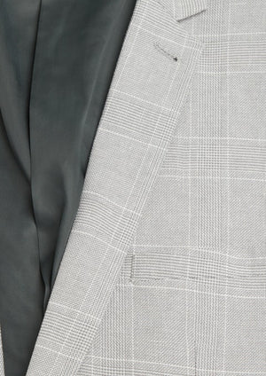 Close-up of the Connor Sorrento Slim Suit Jacket in light gray plaid with a subtle check pattern, partially open to reveal its sleek dark gray lining—an elegant slim fit choice for men.