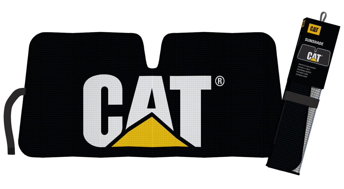 An unfolded CAT Icon Sunshade with bold white letters spelling "CAT" and a yellow triangle logo printed on a black background hangs beneath the rearview mirror. The package for the CAT Icon Sunshade, featuring the same CAT logo, is also shown to the right.