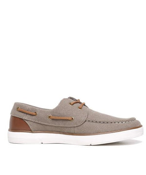 The Colorado Ailon Canvas is a casual boat shoe with a light brown canvas and leather upper, brown leather accents, white stitching, and a sturdy white rubber sole. It features brown leather laces woven through side eyelets for a classic look.