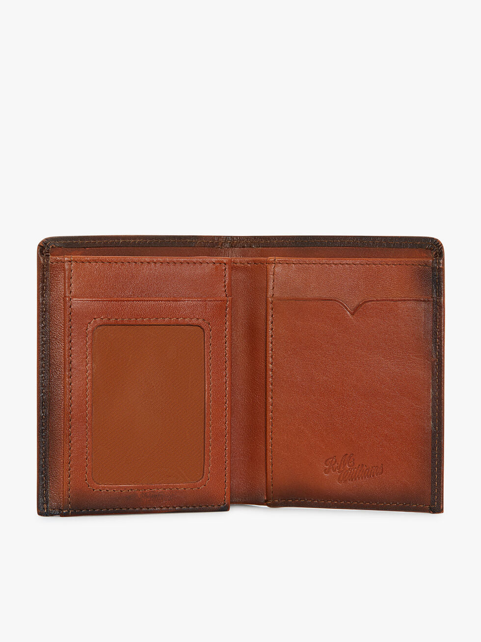 The RM Williams Urban Small Slim Tri-Fold wallet in full grain leather features visible card slots, an ID window on the left, and a subtle embossed logo on the right, set against a plain white background.
