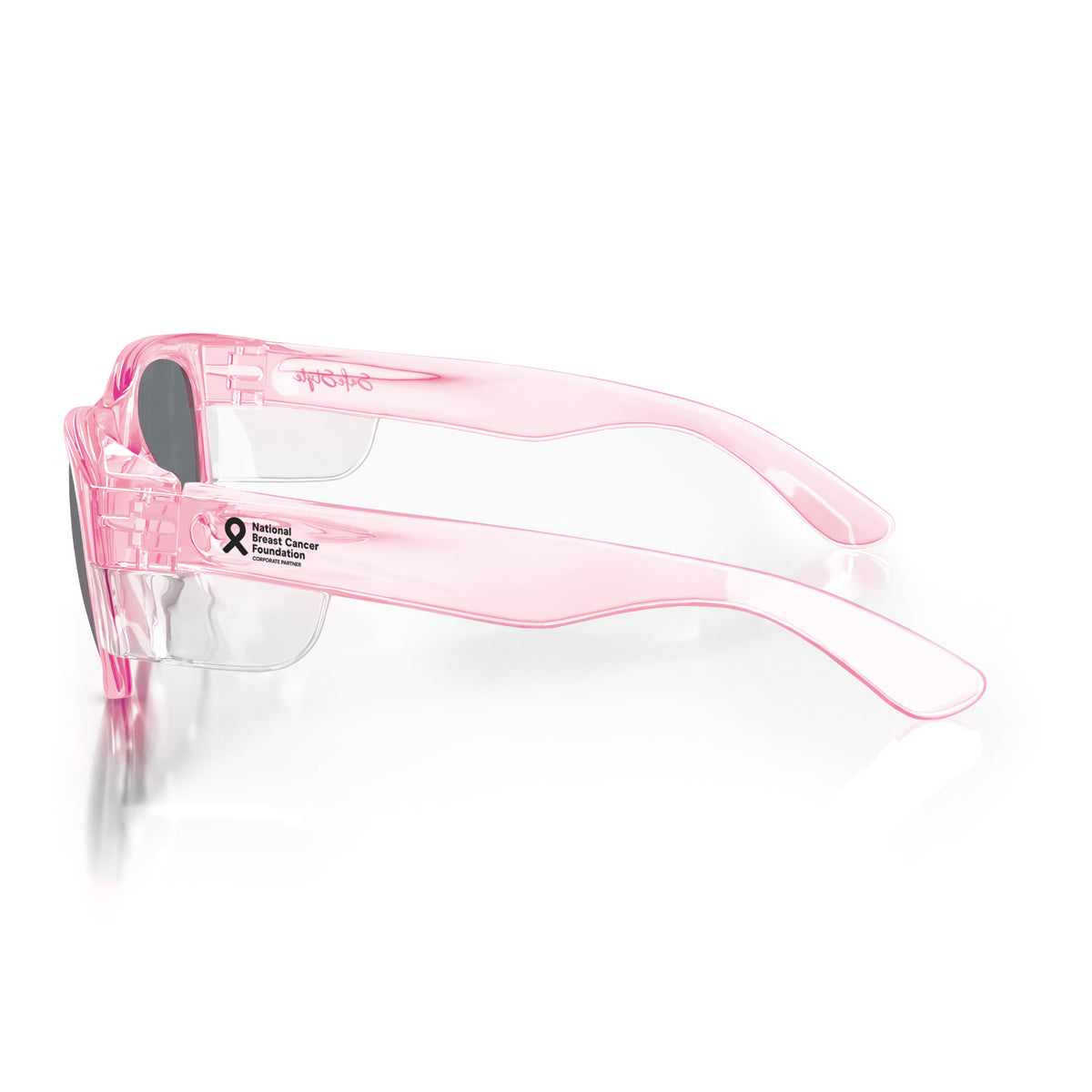 The SafeStyle Classics feature a sleek pink frame with tinted lenses and wide arms for UV protection. The left arm has a small black breast cancer awareness ribbon with "Breast Cancer Awareness" text, combining safety and support for the cause.