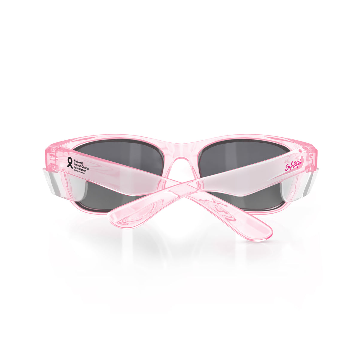Front view of SafeStyle Classics Pink Frame Tinted Lens sunglasses with dark UV-protective lenses, crossed arms, and a small breast cancer awareness ribbon and text on the left frame.