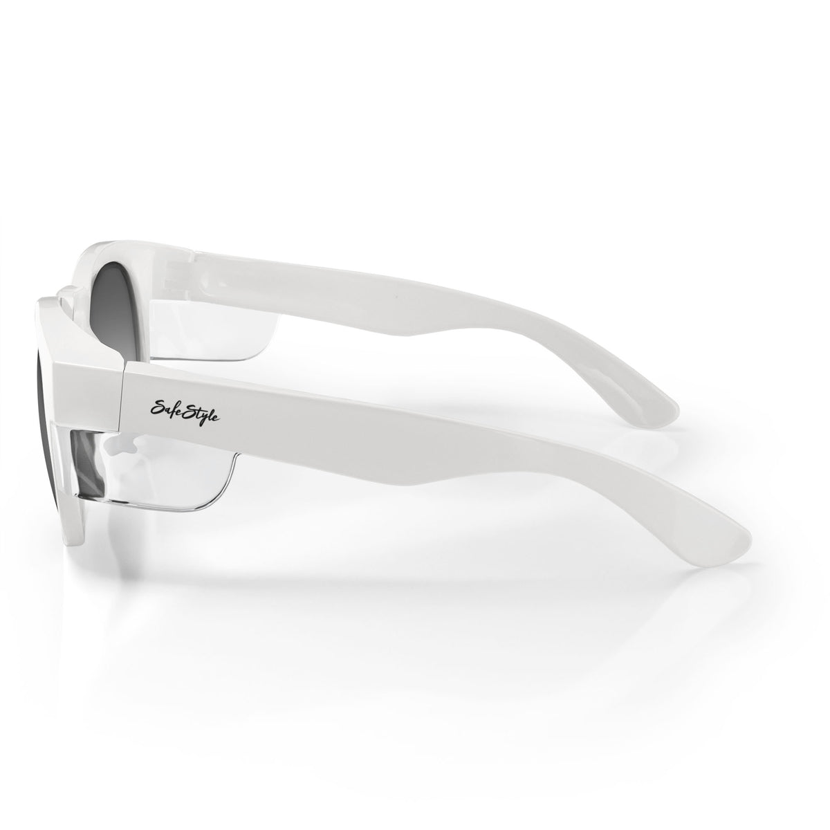 The SafeStyle Cruisers feature white, thick polycarbonate frames and tinted polarized lenses with UV400 protection. A cursive "Style Style" logo embellishes the side arms. Placed on a reflective surface, they create a mirrored effect.