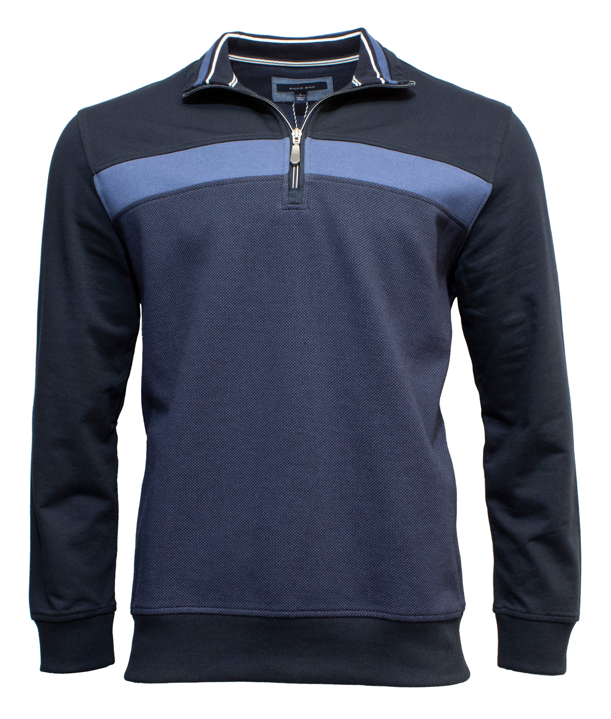 The Back Bay French Terry Chest Panel Fleece is a navy blue rib-knit casual jumper with a lighter blue stripe across the chest. It features a standing collar, a half-zip design halfway down, and solid navy long sleeves.