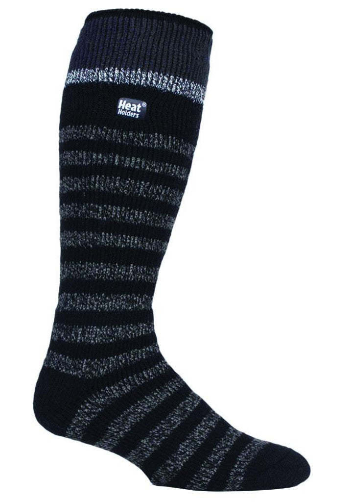 A single Heat Holders Long Sock in black, featuring grey and dark blue stripes. This knee-high, insulated sock has a small white label near the top that reads "Heat Holders." The material is thick and warm, making it an ideal thermal sock for chilly weather.