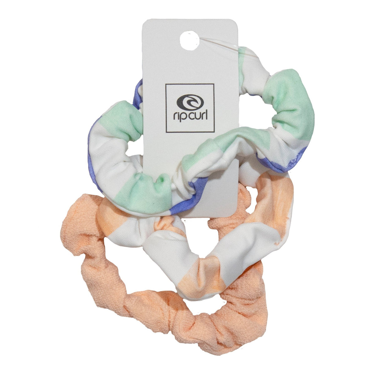 The Rip Curl 3pk Surf Scrunchie features two chic polyamide scrunchies: one in pastel green and white with purple accents, the other in peach and white. They are elegantly presented on a card with the Rip Curl logo.