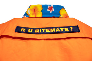 The Ritemate R U Hi Vis Taped Vented Open Front Light Weight Shirt is an orange cotton twill shirt with a blue collar, yellow and red hibiscus flowers, and a navy "R U RITEMATE?" patch for a bold tropical workwear look.