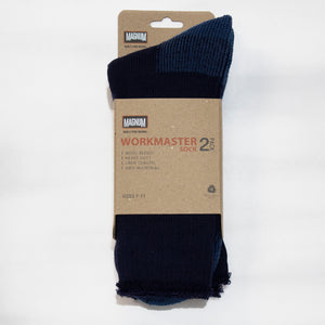 A pair of "Magnum Workmaster Wool Blend 2pk Socks" in blue and navy, designed specifically for work, is displayed in its packaging. The label highlights that these heavy-duty socks are wool blend, crew length, and feature anti-microbial properties for optimal moisture management. They are available in a size range of 7-11.