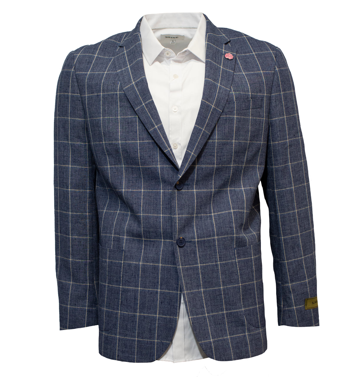 The Uberstone Tyson Jacket, a blue checkered slim fit blazer, is displayed on a mannequin with a white dress shirt underneath. Featuring classic tailoring, two buttons, and a red and white pin on the left lapel, this linen polyester piece exudes timeless elegance.