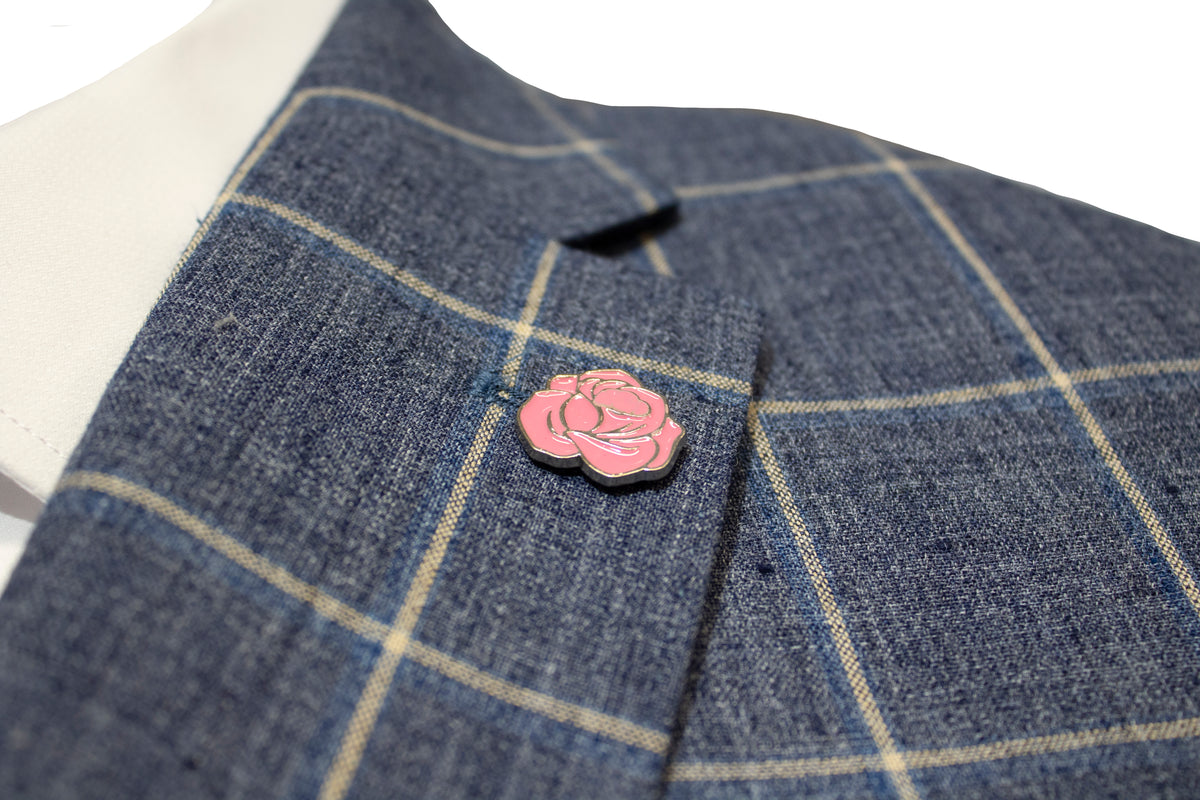 Close-up of the Uberstone Tyson Jacket in a slim fit, showcasing a gray plaid design with yellow lines and adorned with a pink rose enamel pin on the lapel. Made from linen polyester, this suit jacket is set against a plain white background.