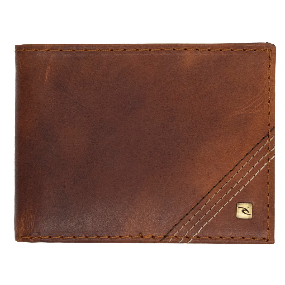 The Rip Curl Surf Revival RFID All Day Wallet is made of brown nubuck leather with visible stitching and diagonal stitched lines in the bottom right corner. It has a small Rip Curl metal logo patch nearby, offering RFID protection and a smooth, rich brown texture.