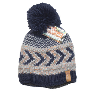 Introducing the Anticorp Ladies Arrow Lined Beanie: a woolen beanie adorned with a large pom-pom on top, featuring a stylish zigzag pattern in dark blue, light blue, and beige. The beanie is branded with a "Patagonia" label and comes with a vibrant tag, offering cozy fleece lining for additional warmth.