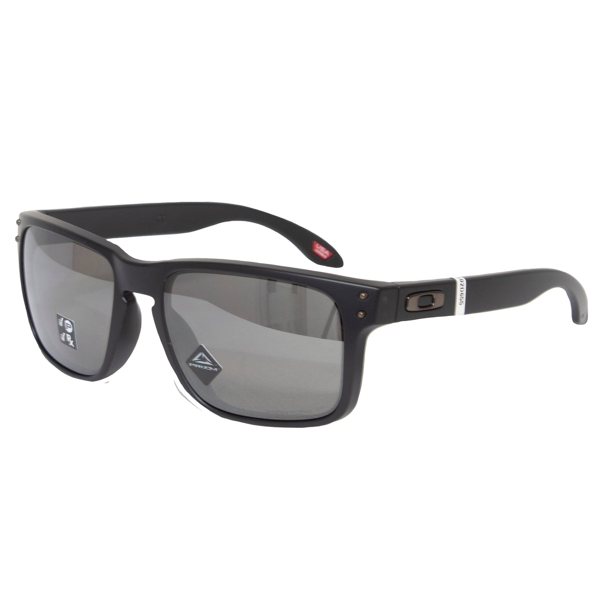 The Oakley Holbrook sunglasses feature a black frame with polarised lenses, a metallic logo near the hinge, and Prizm technology for enhanced optics. They sport a white accent on the temple and are angled against a white background, exuding sleek sophistication.
