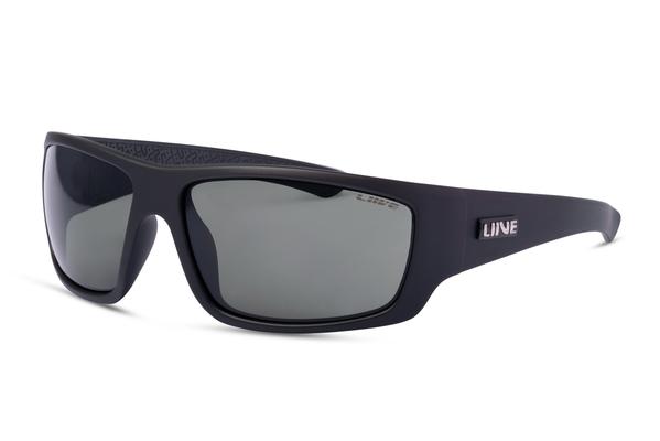 The Liive Kuta Sunglasses are black wraparound shades featuring dark polarized lenses and the brand name "Liive" on the temple. Made from lightweight polycarbonate, these sunglasses boast a sleek design with slightly curved earpieces and a textured pattern on the inside of the arms for a secure fit and UV protection.