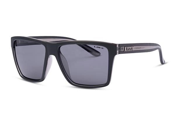 A pair of Liive Bazza Polar Sunglasses featuring black square-frame and dark tinted lenses. The brand name "Liive" along with additional text is printed on one of the temples. These lightweight TR-90 frame sunglasses are angled slightly to the right, showcasing the profile of the left temple.