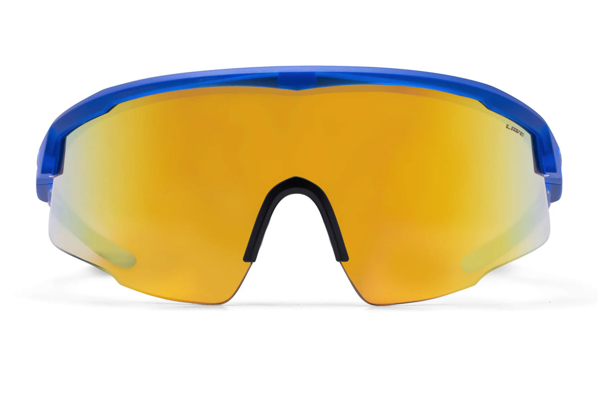 Close-up of Liive Dealer Mirror Sunglasses with blue frame and large yellow mirrored lenses. This sleek, lightweight polycarbonate design features a black nose pad and wrap-around style for UV protection during outdoor activities.