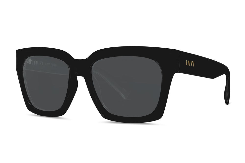 The Liive Lima Sunglasses feature large, square frames with dark lenses for stylish UV protection. Their modern, lightweight polycarbonate design is sleek, and "Liive" inscribed in gold on the left temple adds a touch of elegance to these optically correct sunglasses.